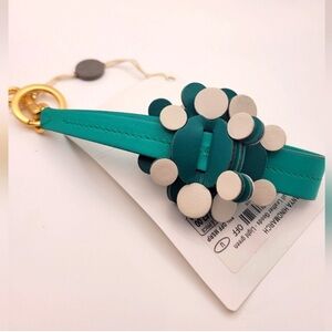 ANYA HINDMARCH Teal and Cream Floral Keychain “I’m Not Plastic” Collection
